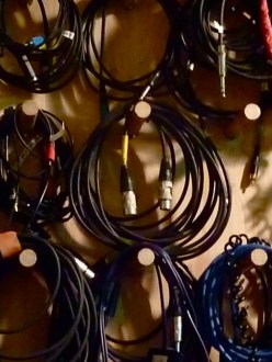 Rolled up sound wires hanging on radio station wall