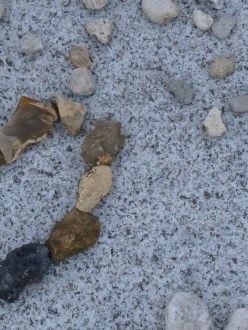 Heart made of stones on marble slab