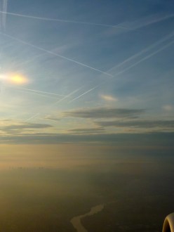 Jet trails from a plane over Paris
