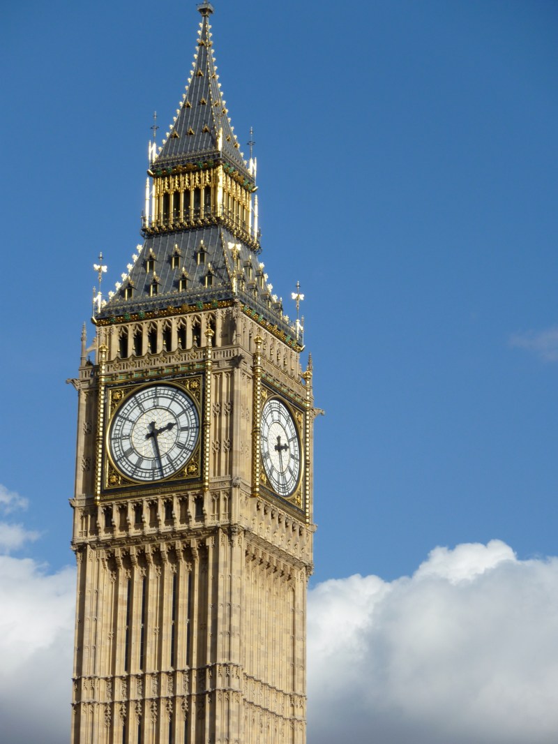 Big Ben on a clear day, clouds below