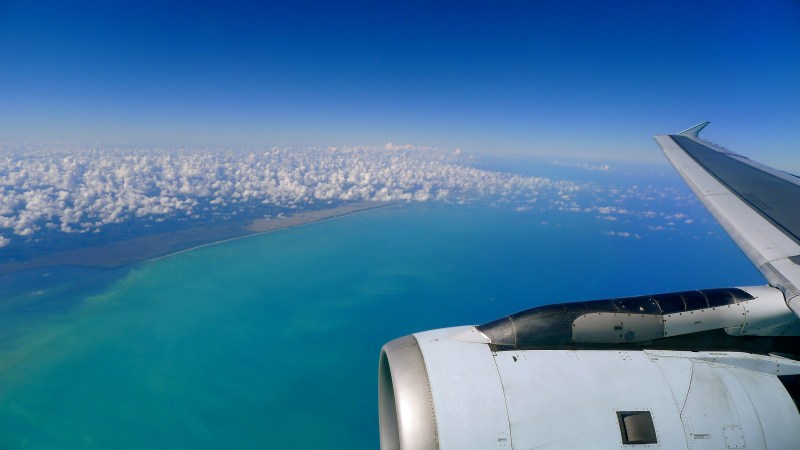 Photo taken out plane window of tropical turquoise waters, sea, ocean
