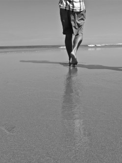 couple walking on beach Australia
