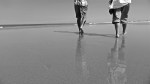 couple walking on beach Australia