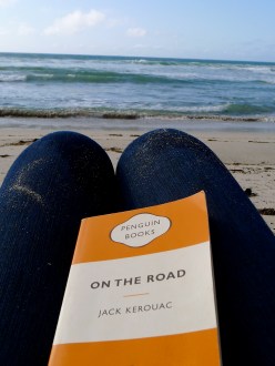 reading on an Australian beach, sunset