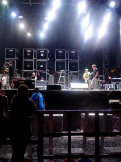 Fans by the concert stage barricade