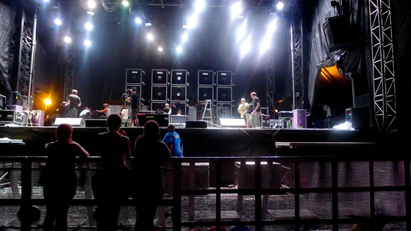 Fans by the concert stage barricade