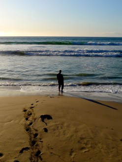 Man stands alone on beach, Kangaroo Island, South Australia