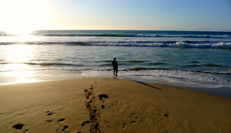 Man stands alone on beach, Kangaroo Island, South Australia